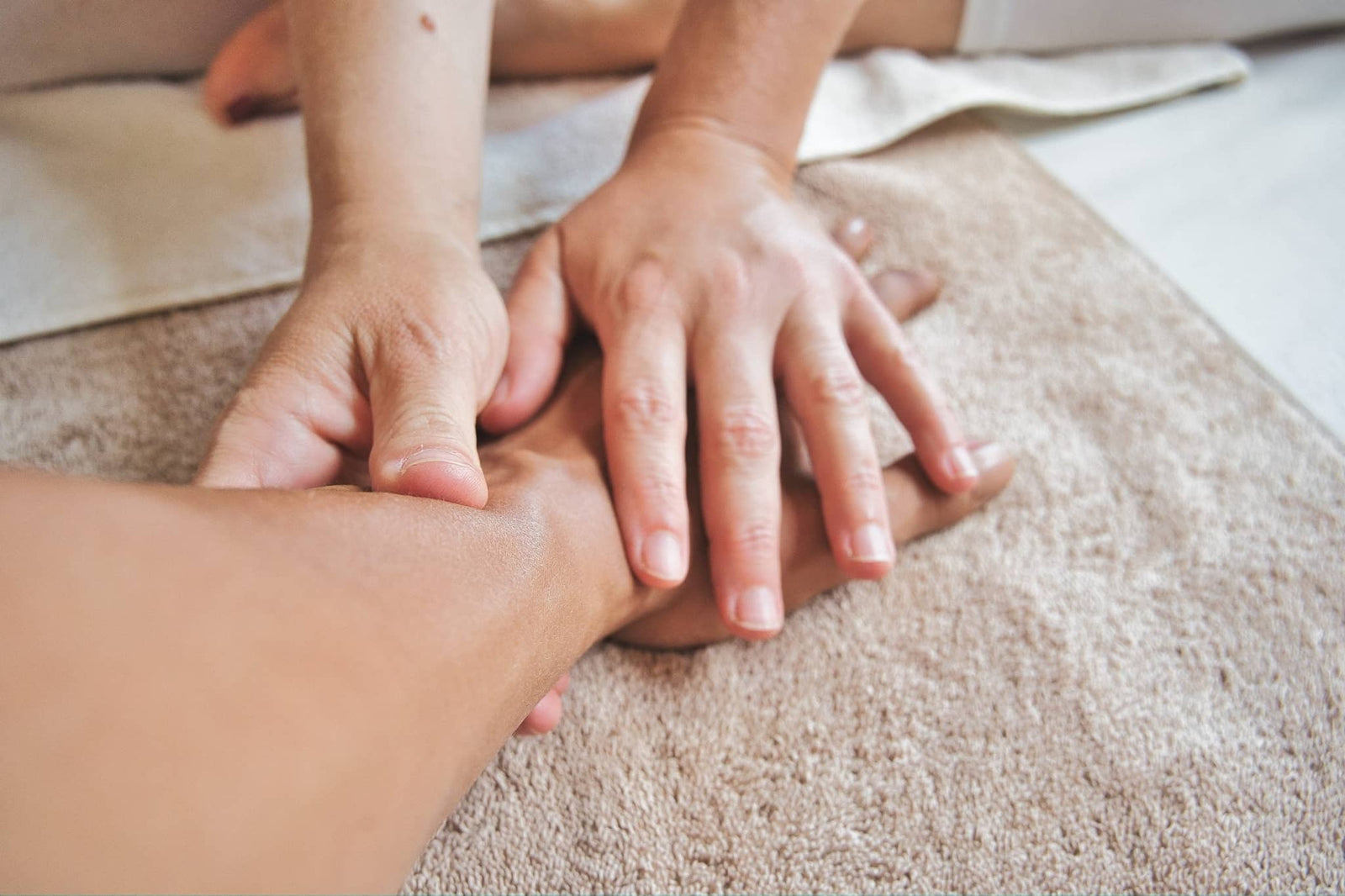 Therapist giving hand massage focusing on breaking the arthritis pain circle and relieving joint discomfort