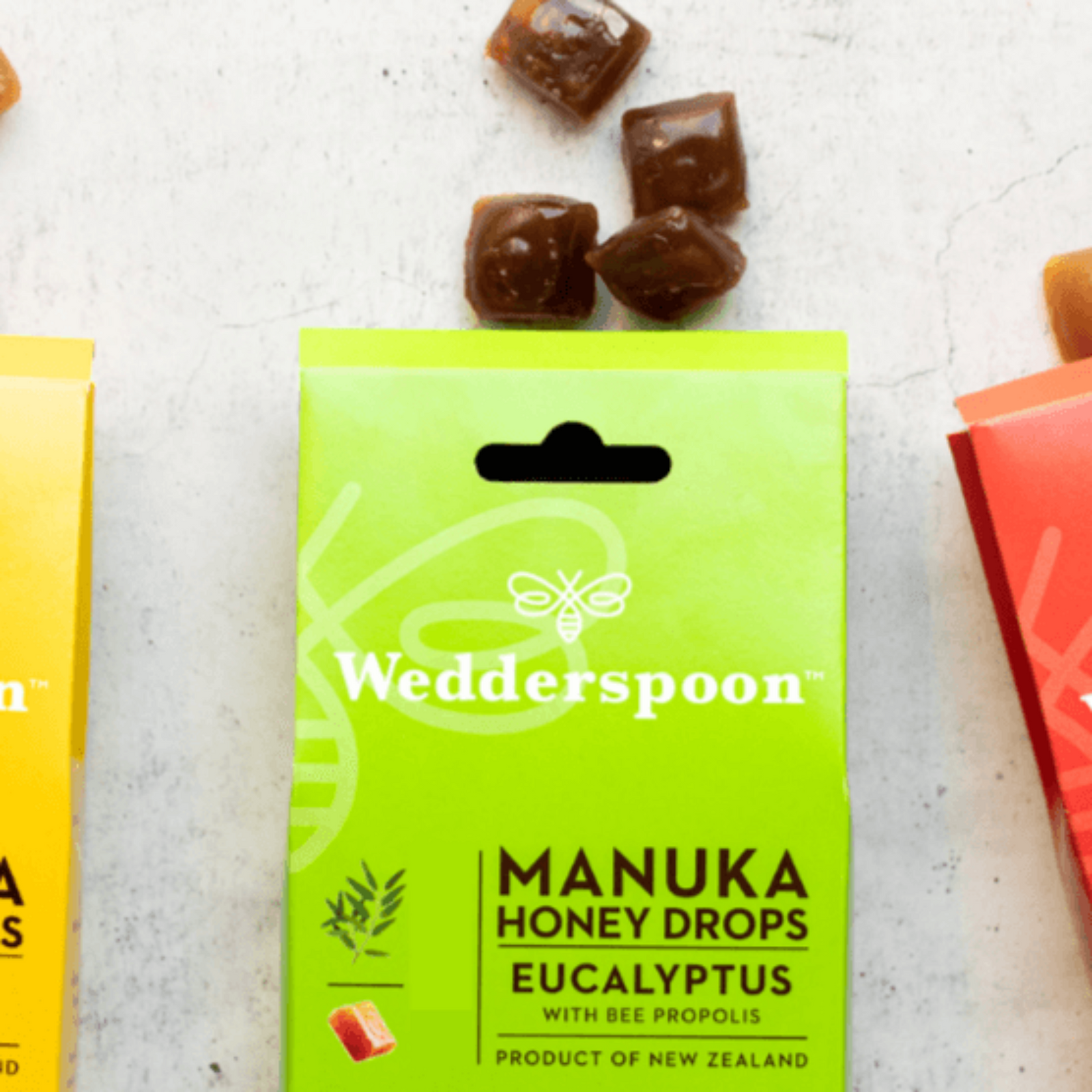 Green package of Wedderspoon Manuka Honey Drops Eucalyptus on a light background