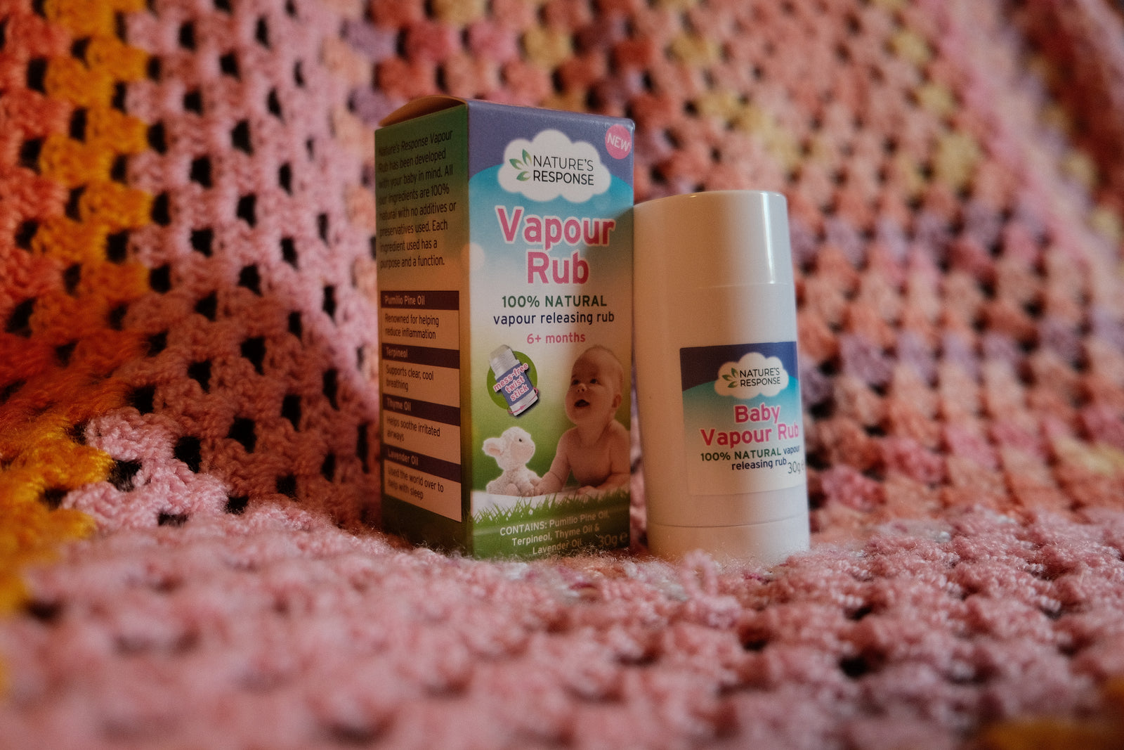 Natures Response natural vapour rub for babies stick and box on pink knitted blanket showing baby image