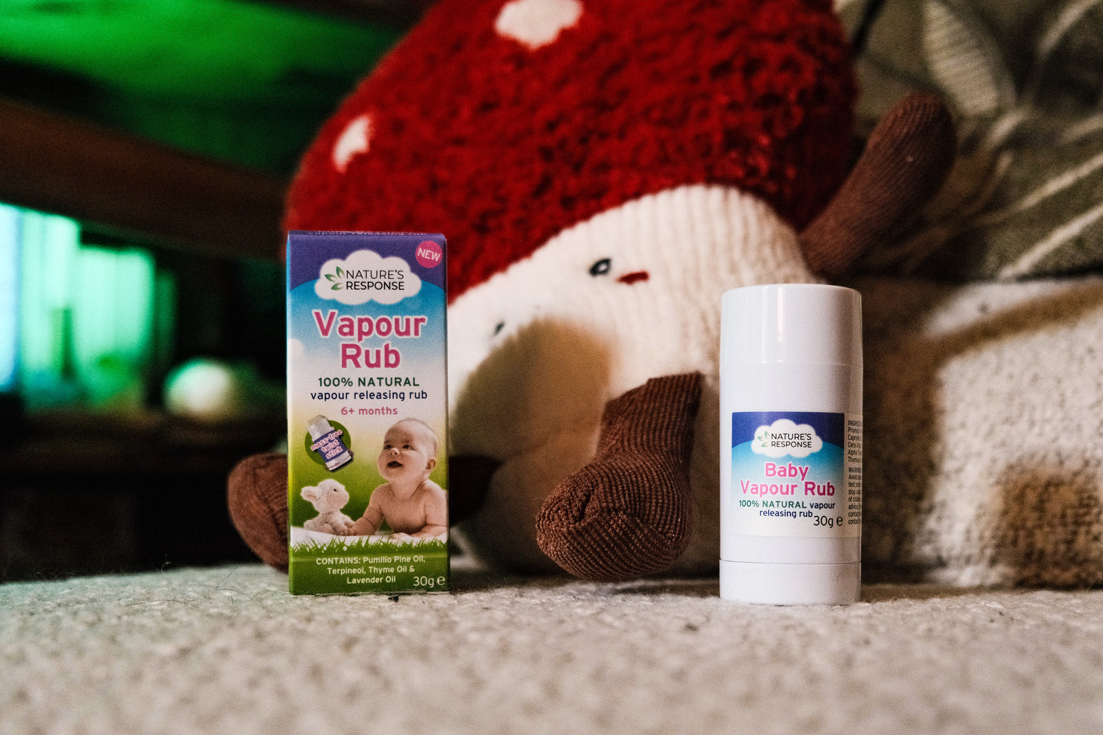 Natures Response natural vapour rub for babies stick and box on soft blanket beside plush toy
