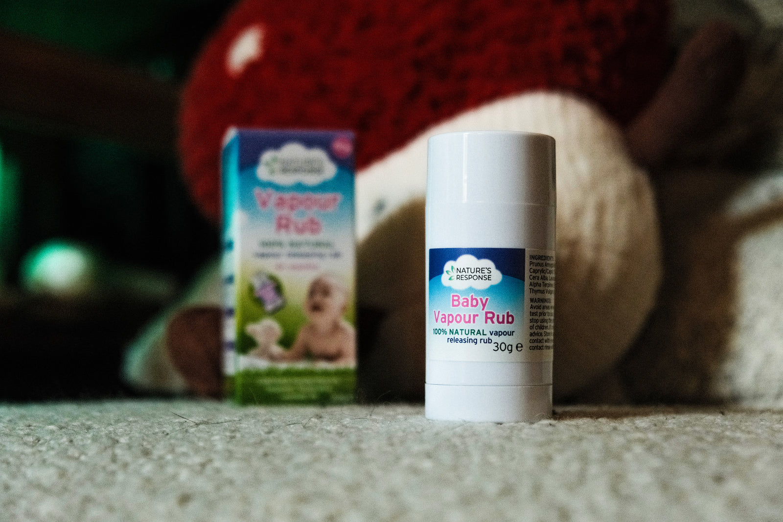 Natures Response baby vapour rub stick and box on carpet beside soft toy natural vapour rub for babies