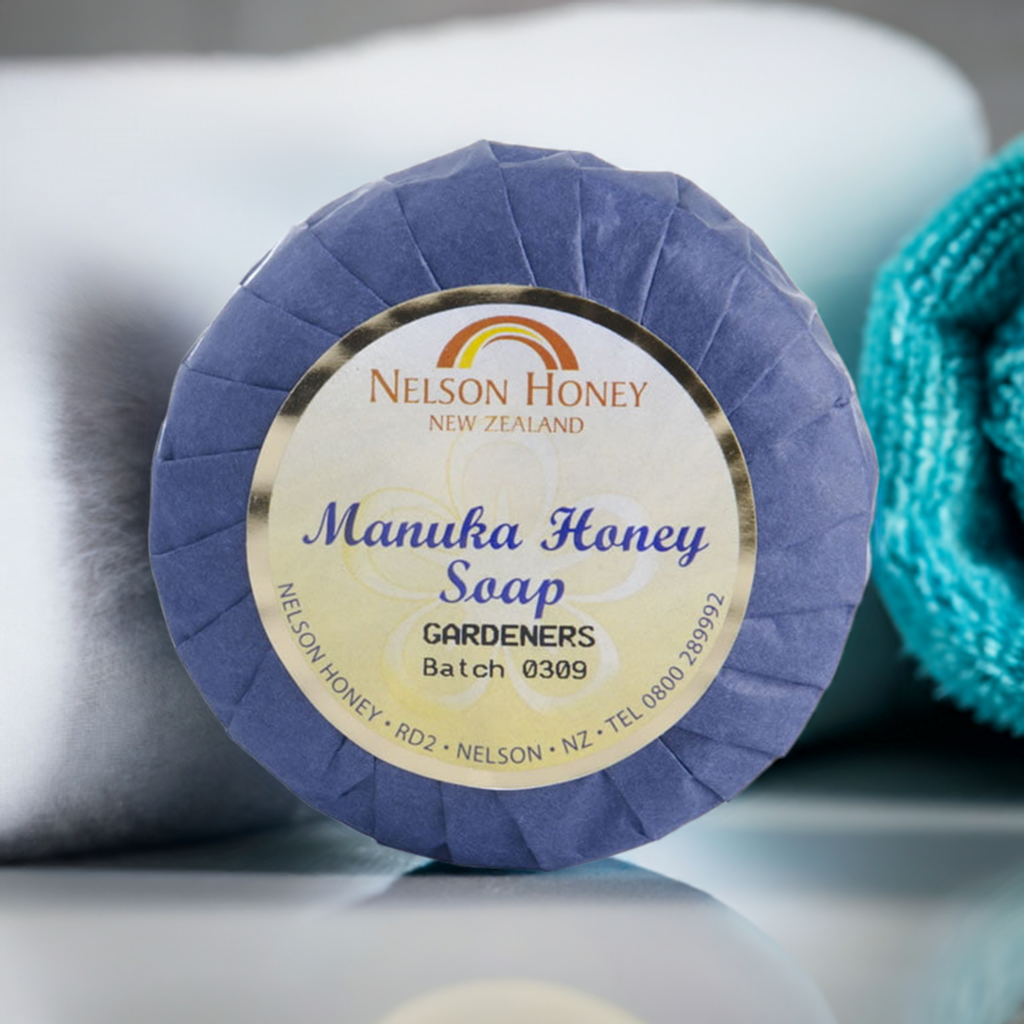 Nelson Honey Manuka honey gardeners soap wrapped in purple paper on spa towels natural gardeners soap with manuka honey