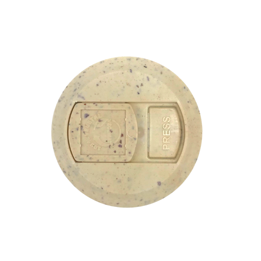 Top view of single beige speckled supplement labeled Royal Gellee capsules 500mg showing press tab embossed PRESS