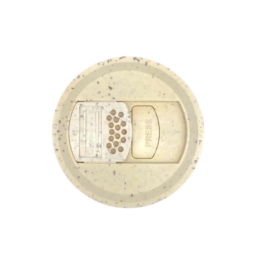 Top view beige speckled round supplement jar lid with press opening and dispenser holes for Rutivite tablets UK
