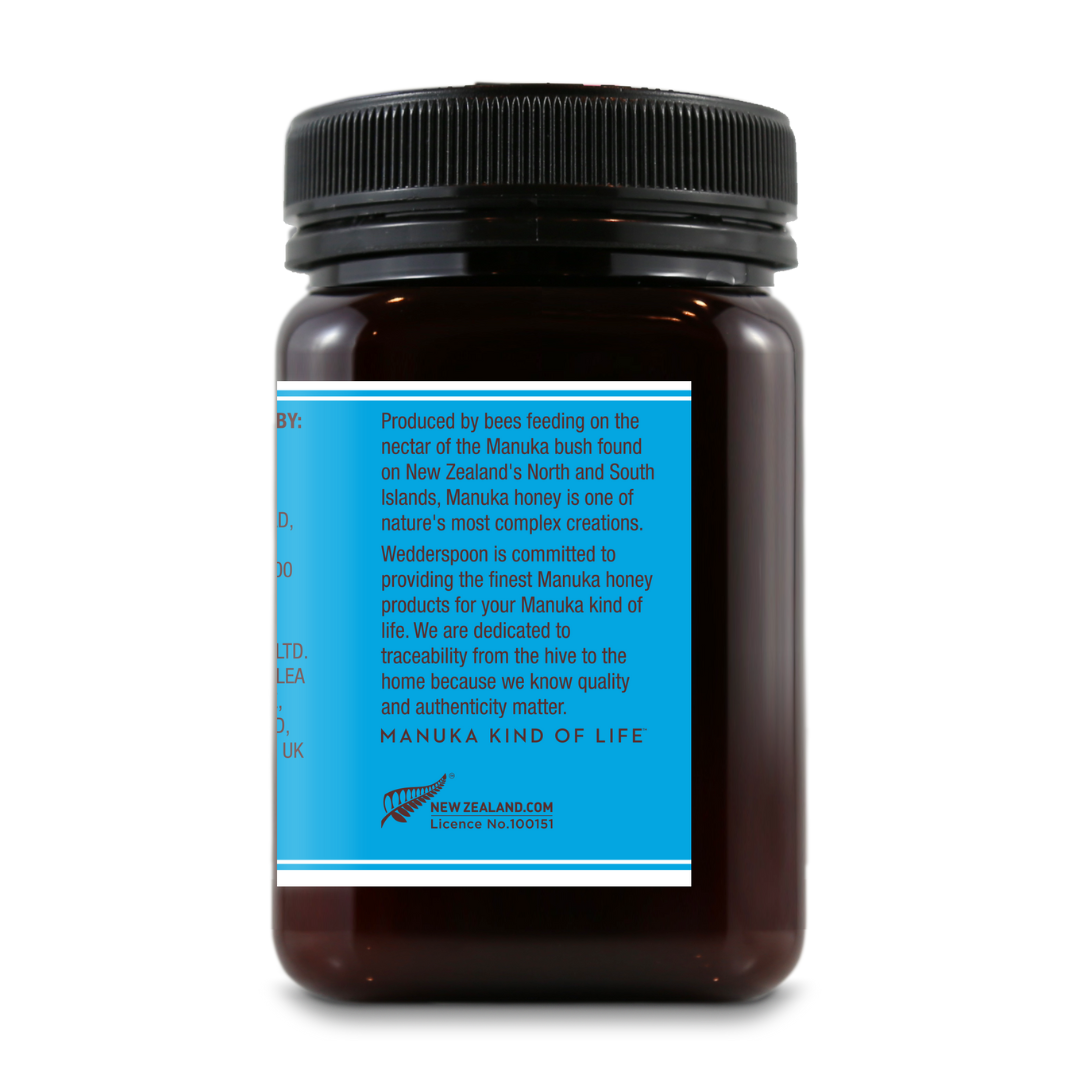 Back view of Wedderspoon KFactor 12 honey jar showing blue label with product details