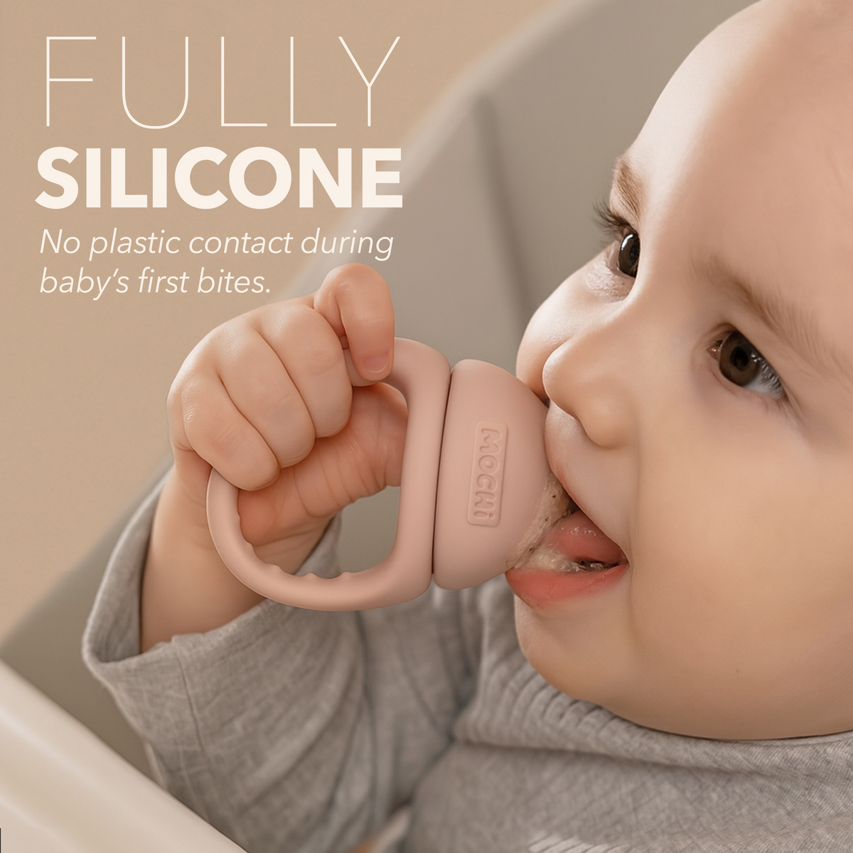 Baby using MOCHi Pop-Up Feeder for Babies Food Grade Silicone with fully silicone design for safe first bites