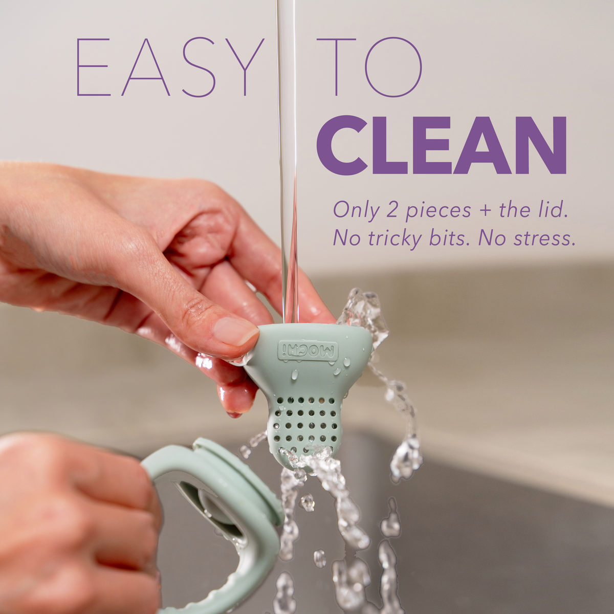 MOCHi Pop-Up Feeder for Babies Food Grade Silicone being washed under running water for easy cleaning