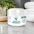 Natural Health World UK joint care cream for pain relief jar on bathroom counter with towel and plant