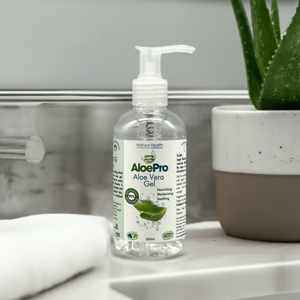 AloePro Natural Soothing Aloe Gel UK 200ml clear pump bottle with aloe plant on bathroom counter