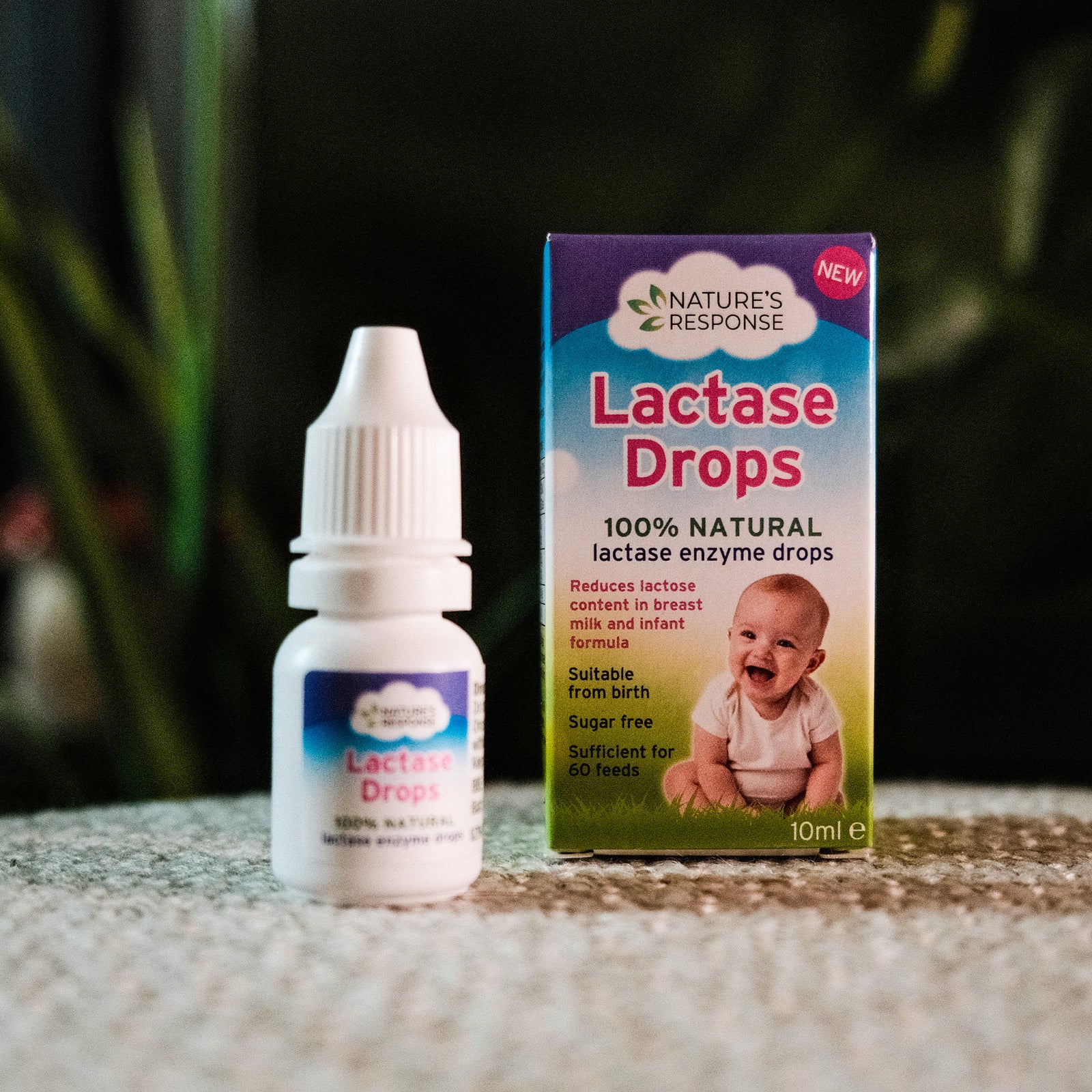 Natures Response natural lactase drops for babies bottle and box packaging with smiling infant