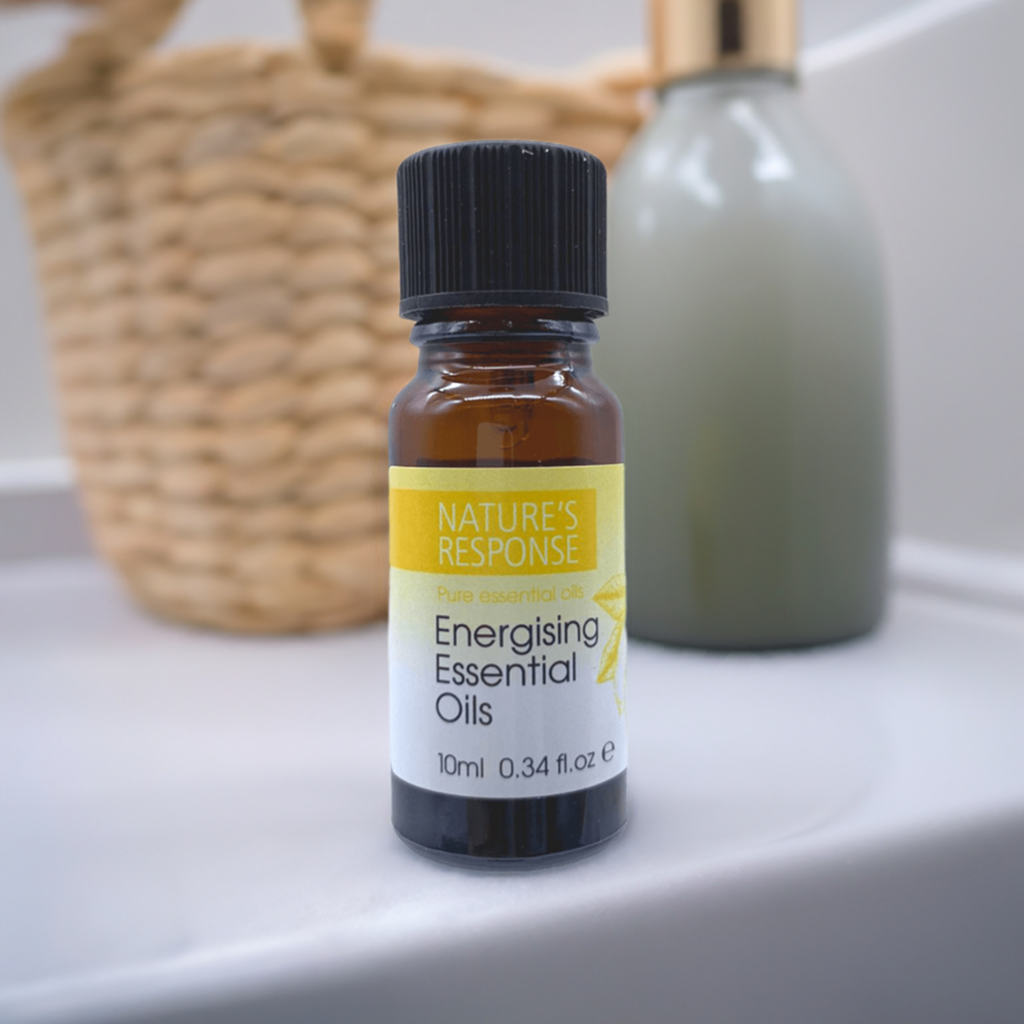 Natures Response tea tree energising essential oil 10ml amber glass bottle on bathroom shelf with wicker basket