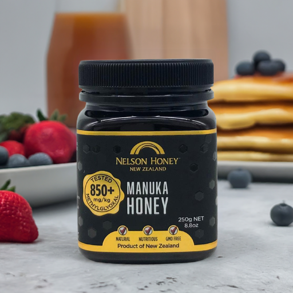Nelson Honey jar of Manuka honey MGO 850+ on breakfast table with pancakes and berries