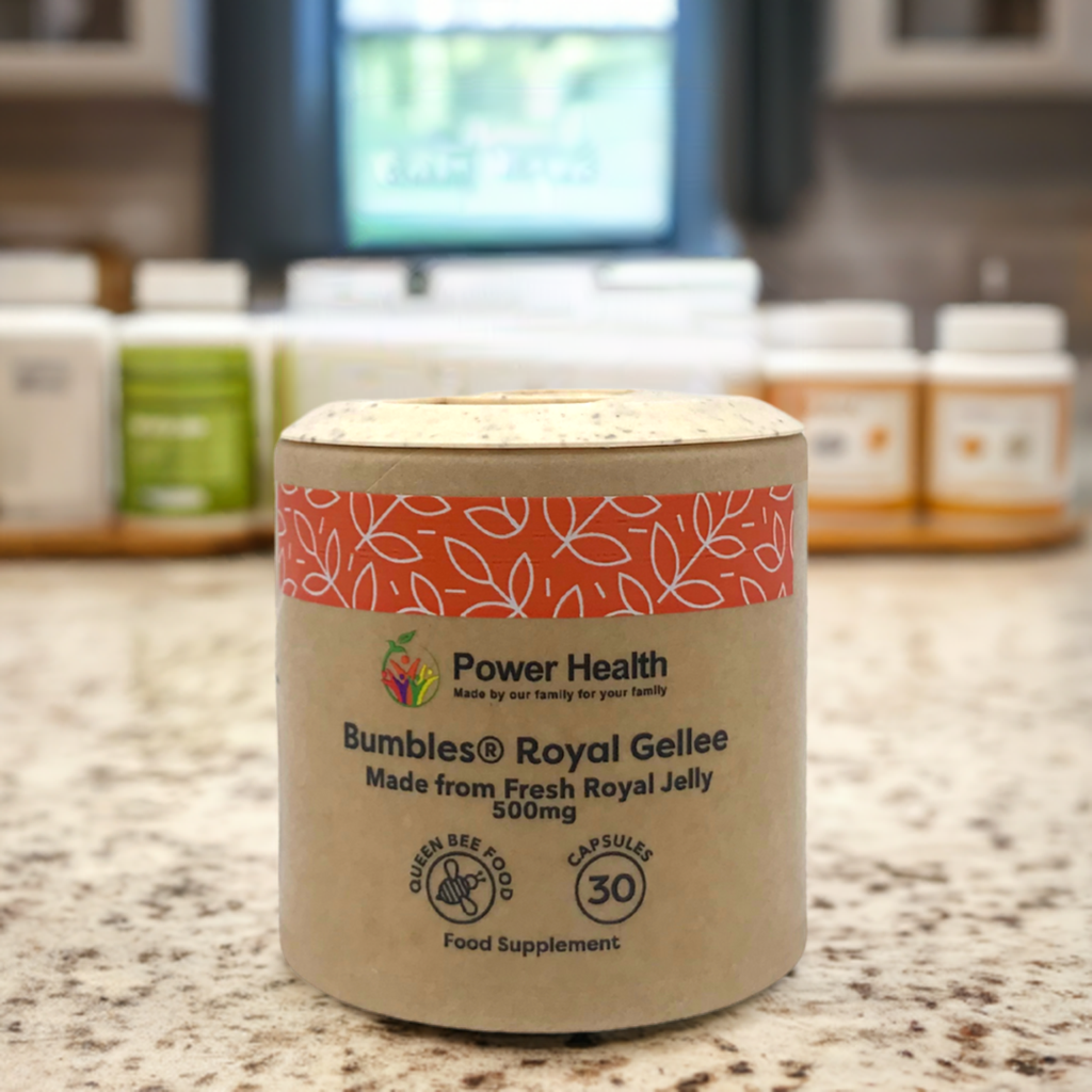 Power Health Bumbles jar of Royal Gellee capsules 500mg on a kitchen counter with supplements