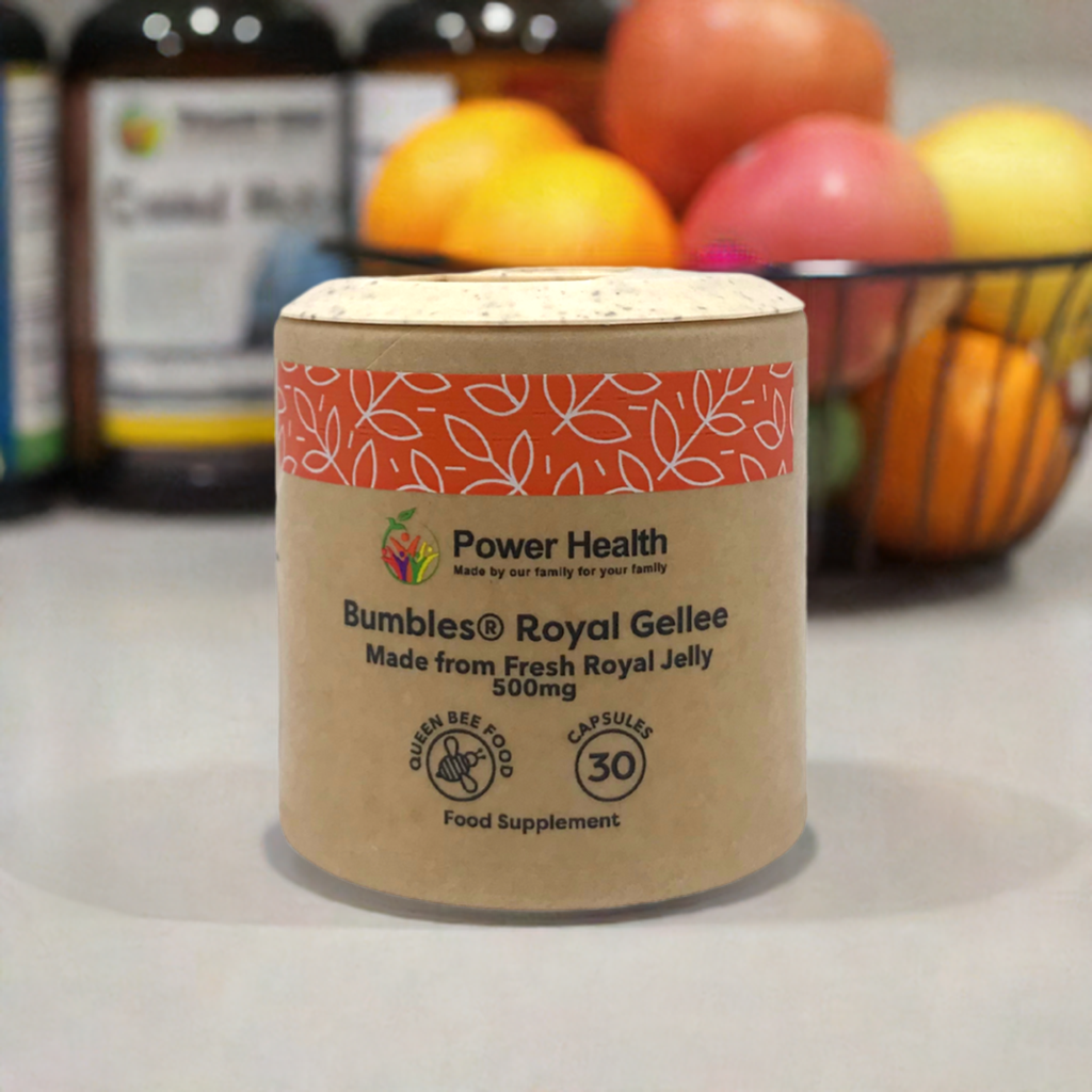 Power Health Bumbles jar of Royal Gellee capsules 500mg cardboard tub with 30 capsules shown against fruit bowl background