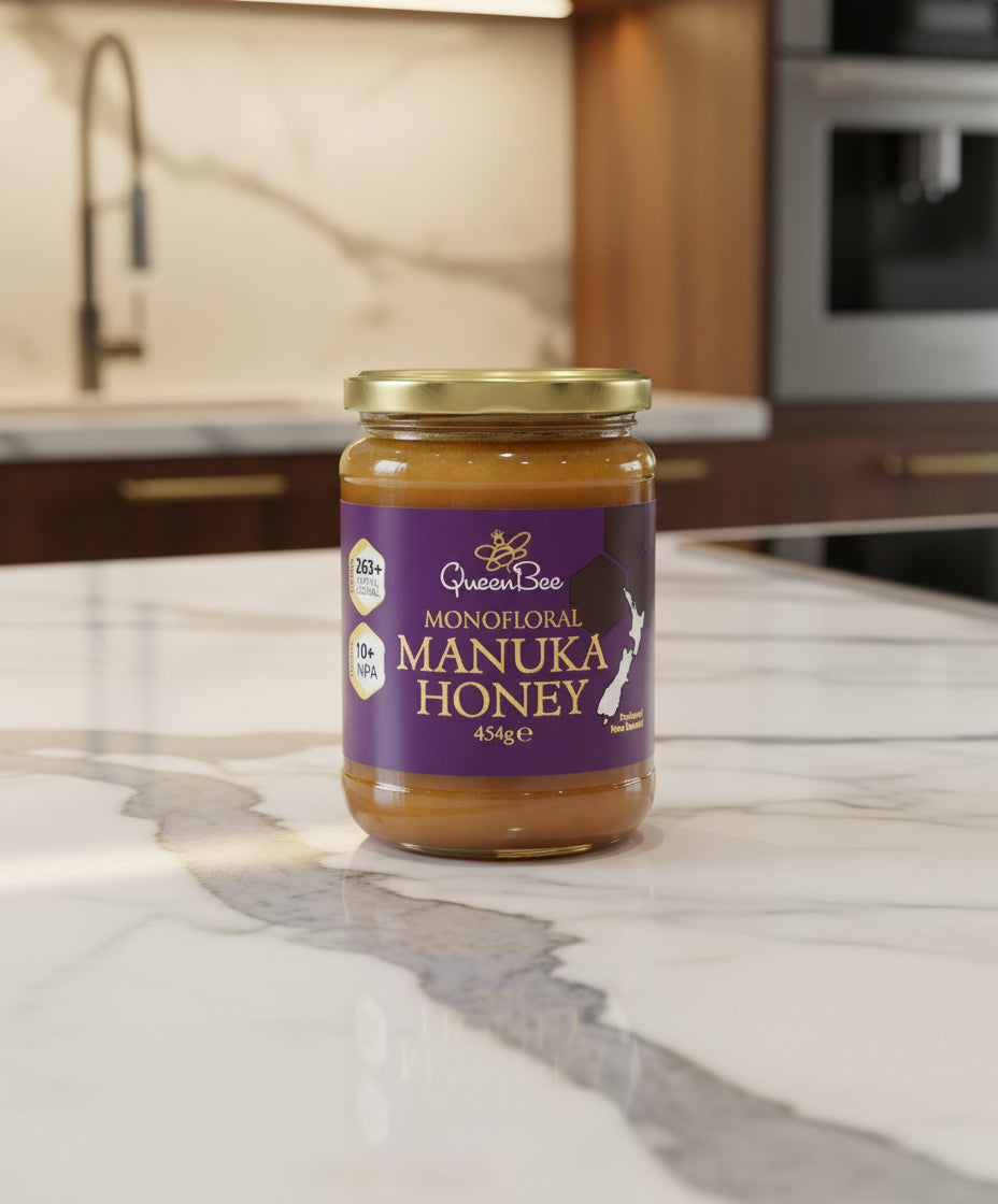Queen Bee Manuka Honey 454g glass jar with purple label and gold lid showing natural monofloral honey