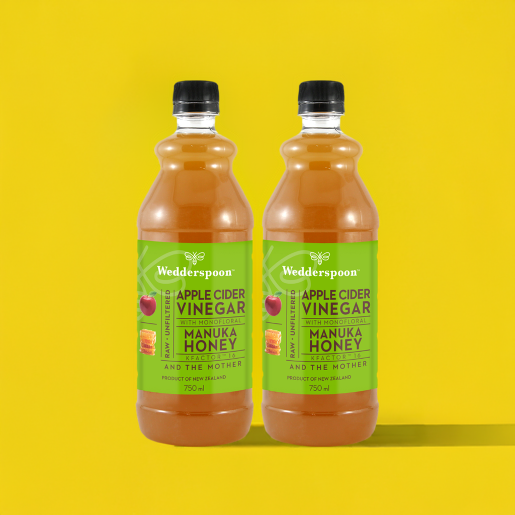 Wedderspoon Apple Cider Vinegar with Manuka Honey Twin Pack 750ml bottles on yellow background