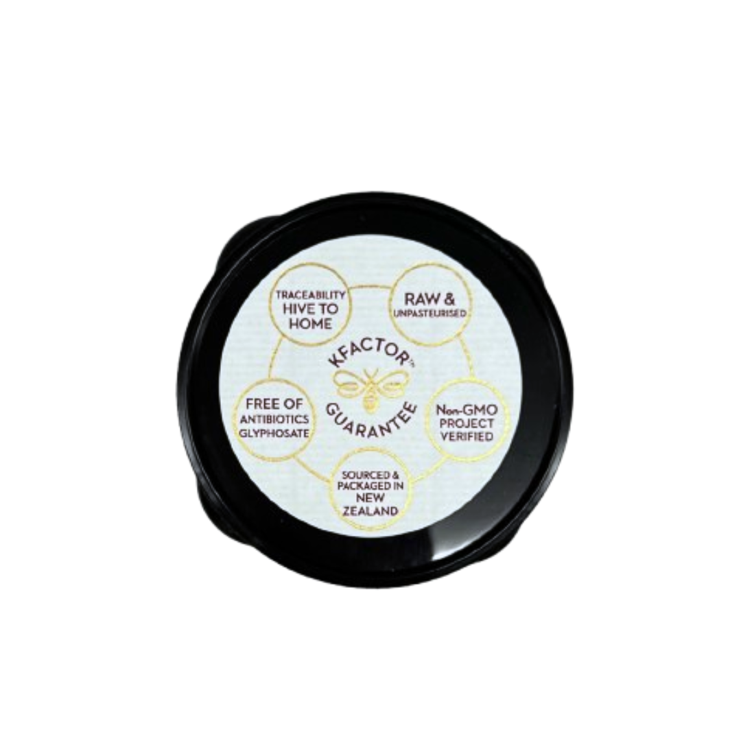 Wedderspoon jar lid label showing KFactor guarantee and certifications for raw manuka honey 850 mgo