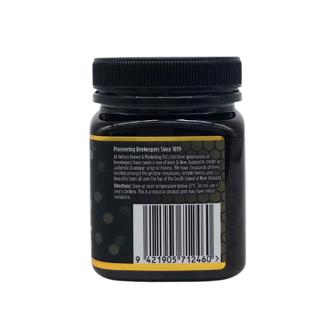 Nelson Honey jar showing back label and barcode of Manuka honey MGO 850+ in dark glass jar