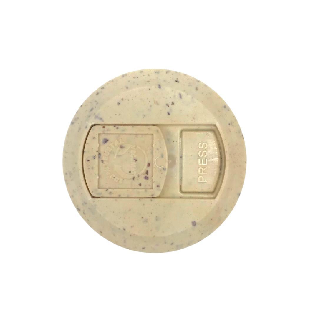 Power Health turmeric capsules with black pepper speckled beige tablet top close up showing press cap detail
