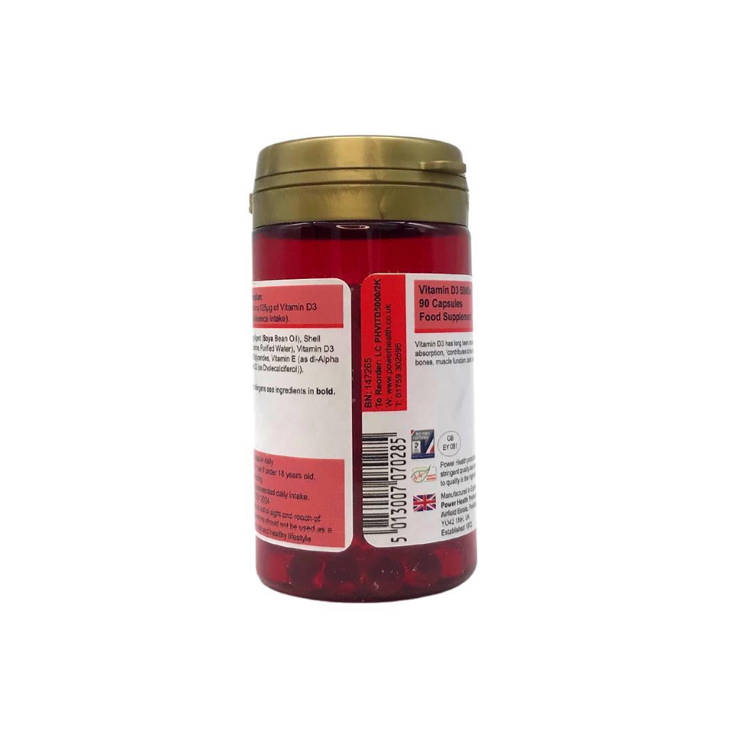 Power Health bottle of Vitamin D3 5000iu capsules red jar with gold lid showing back label and softgel capsules