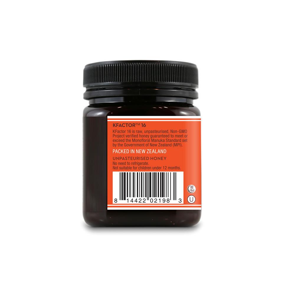 Wedderspoon raw Manuka honey KFactor 16+ jar rear view with orange label barcode black lid packed in New Zealand