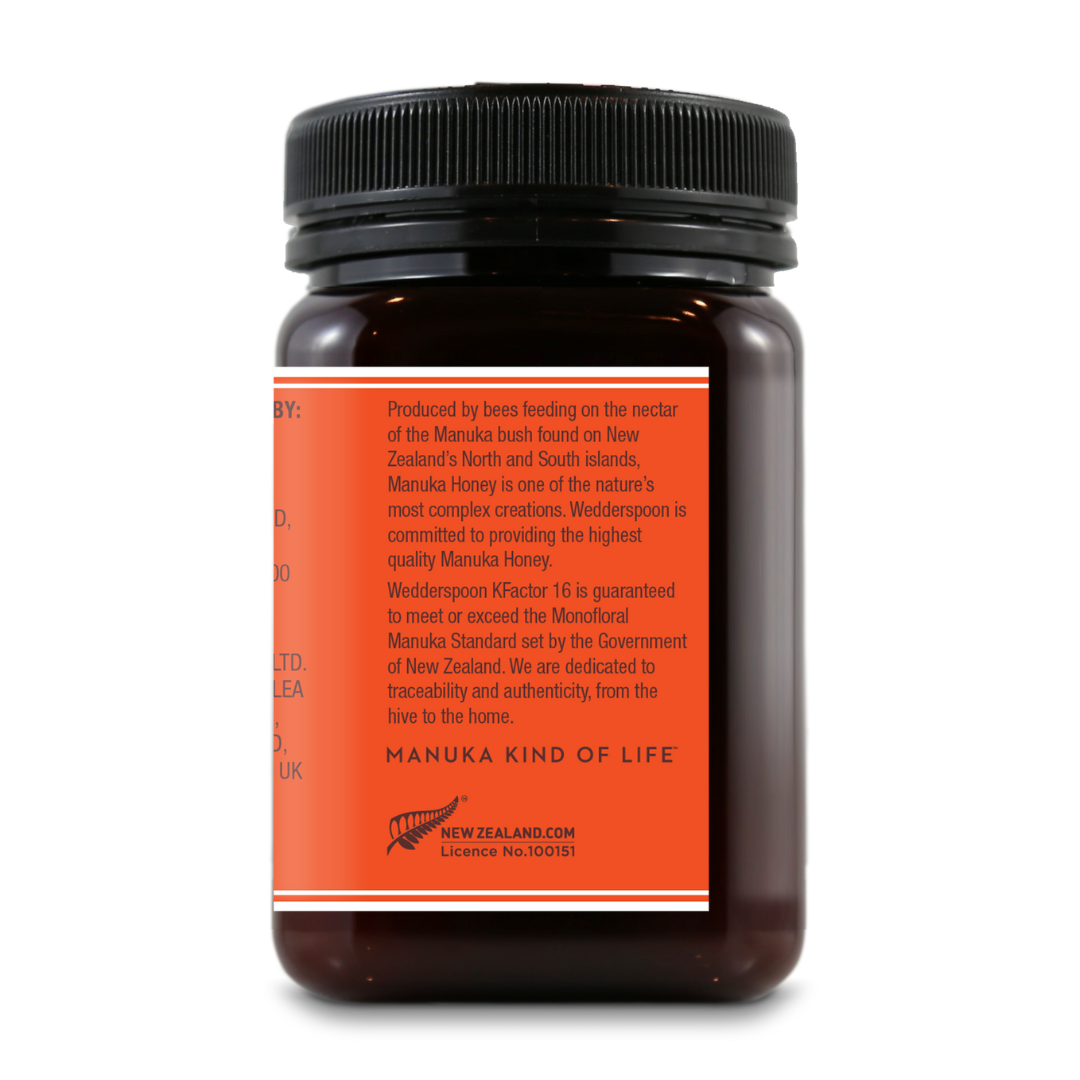 Wedderspoon jar of raw Manuka honey KFactor 16 with orange label from New Zealand